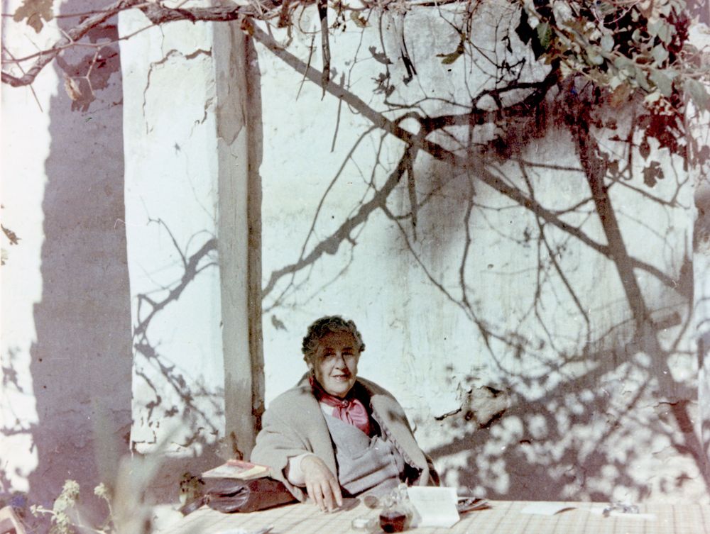 Agatha Christie relaxing during a sightseeing tour, Tajoura, Libya, 1955
