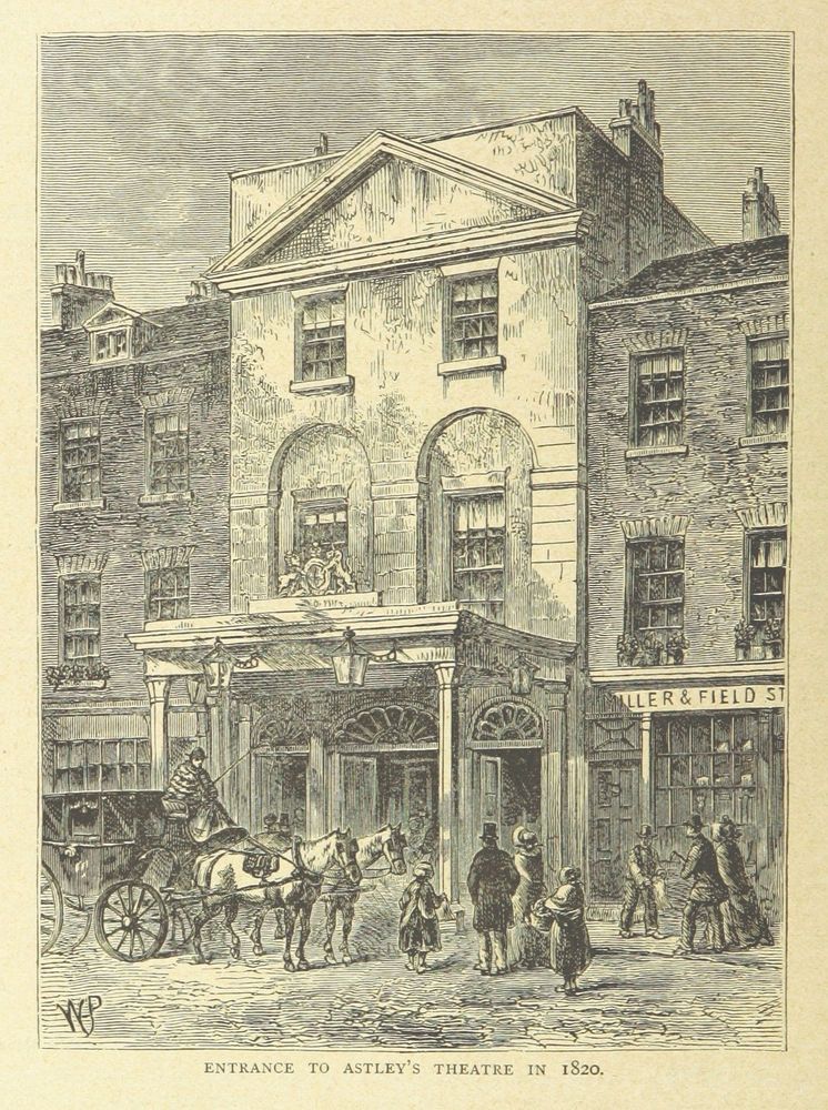 A black and white illustration of the exterior of a 19th century theatre. Outside there are a horse and cart and some well-dressed people. Its caption reads 'Entrance to Astley's Theatre in 1820'.